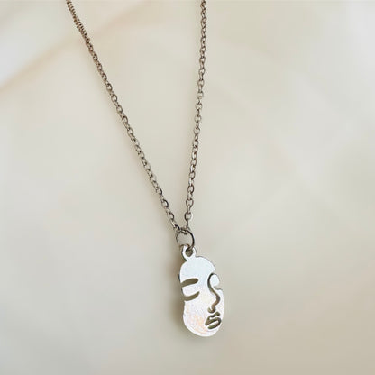 Human face necklace