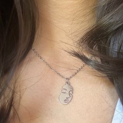 Human face necklace